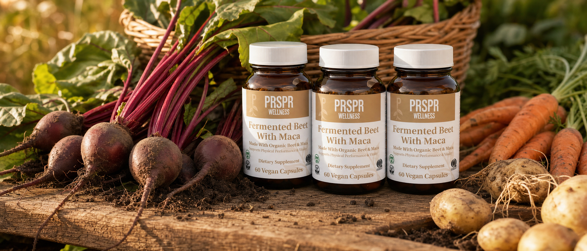 Three jars of PRSPR Fermented Beet With Maca on a farm table among freshly harvested root vegetables: beets, carrots and potatoes