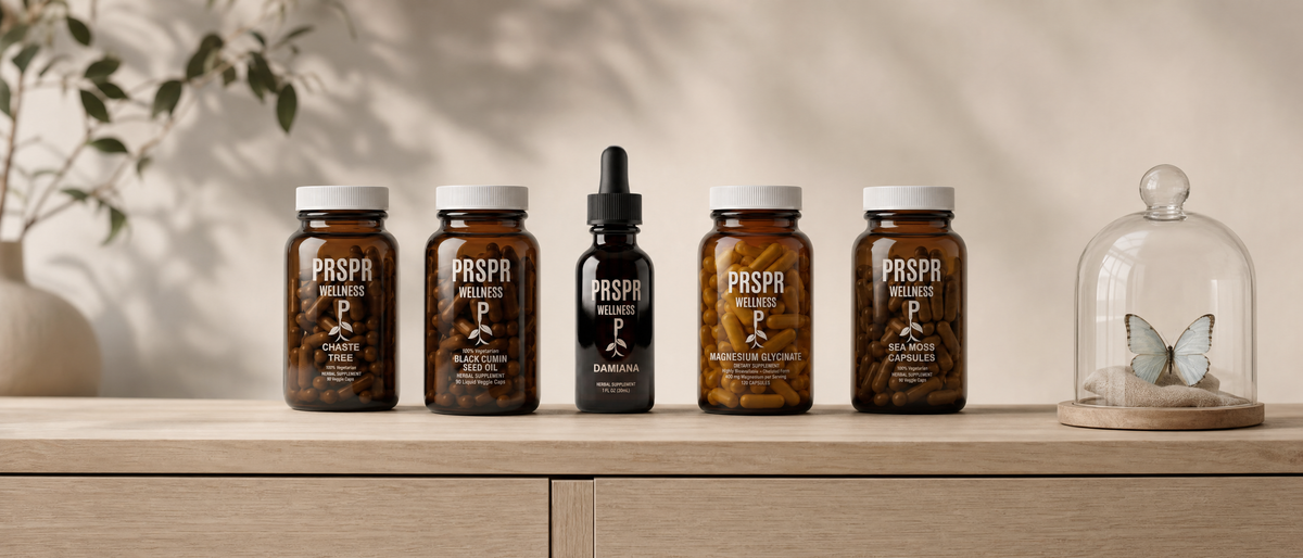 Five PRSPR Wellness supplement jars and a dropper bottle in a row on an oak sideboard beside a butterfly under a glass dome