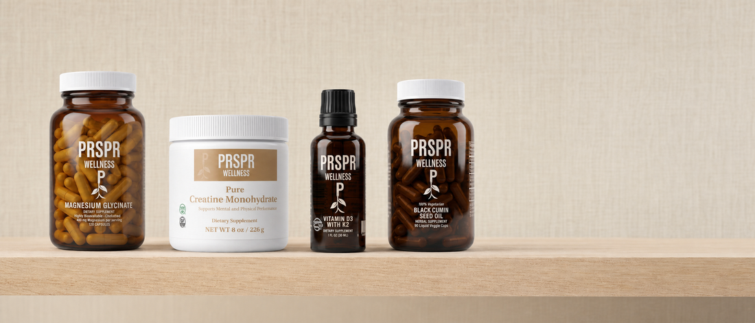 PRSPR Magnesium Glycinate, Pure Creatine Monohydrate, Vitamin D3 with K2 and Black Cumin Seed Oil on an oak shelf