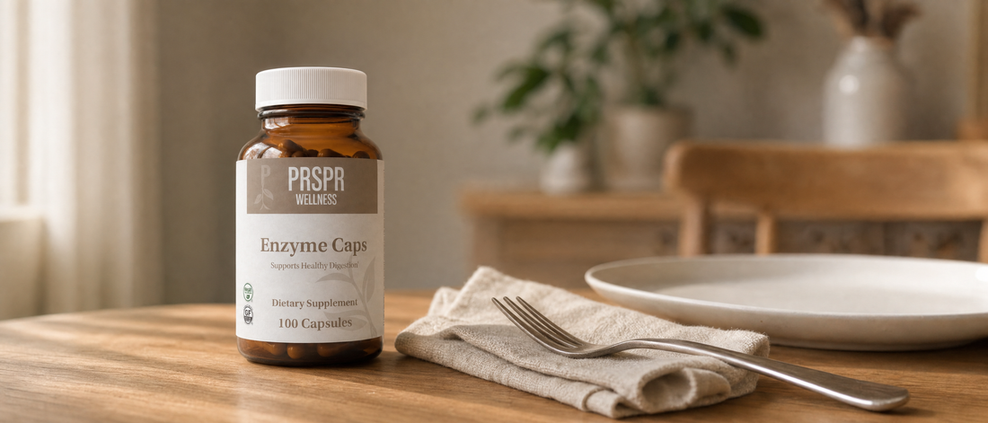 PRSPR Wellness Enzyme Caps bottle on a wooden dining table beside a folded napkin and a white plate