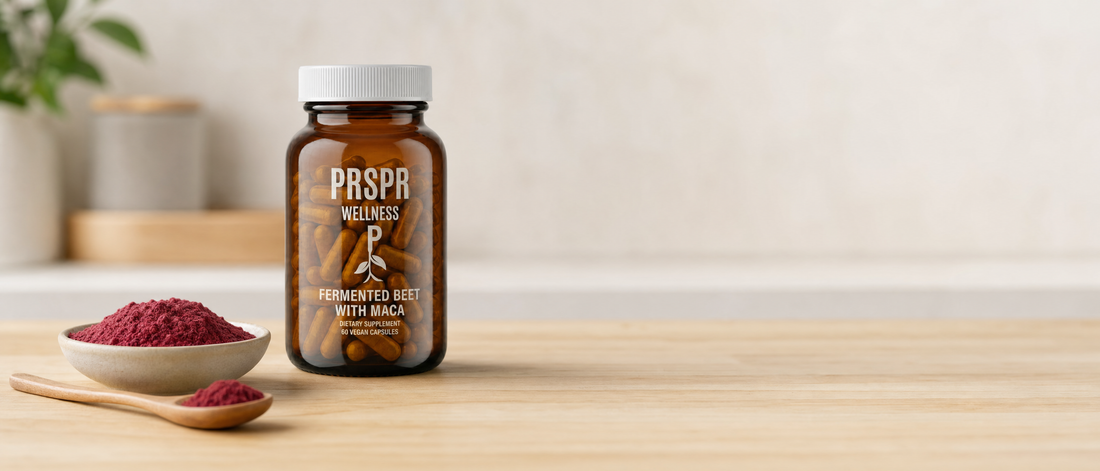 PRSPR Wellness Fermented Beet Root and Maca capsule bottle beside a bowl of deep red root powder