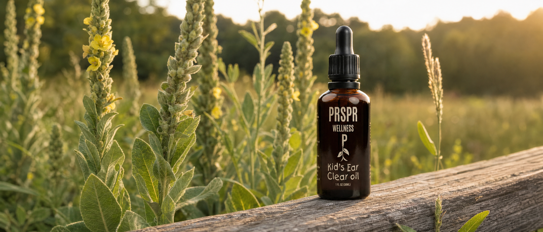 PRSPR Kids Ear Clear Oil on a wooden ledge in front of wild mullein plants at golden hour