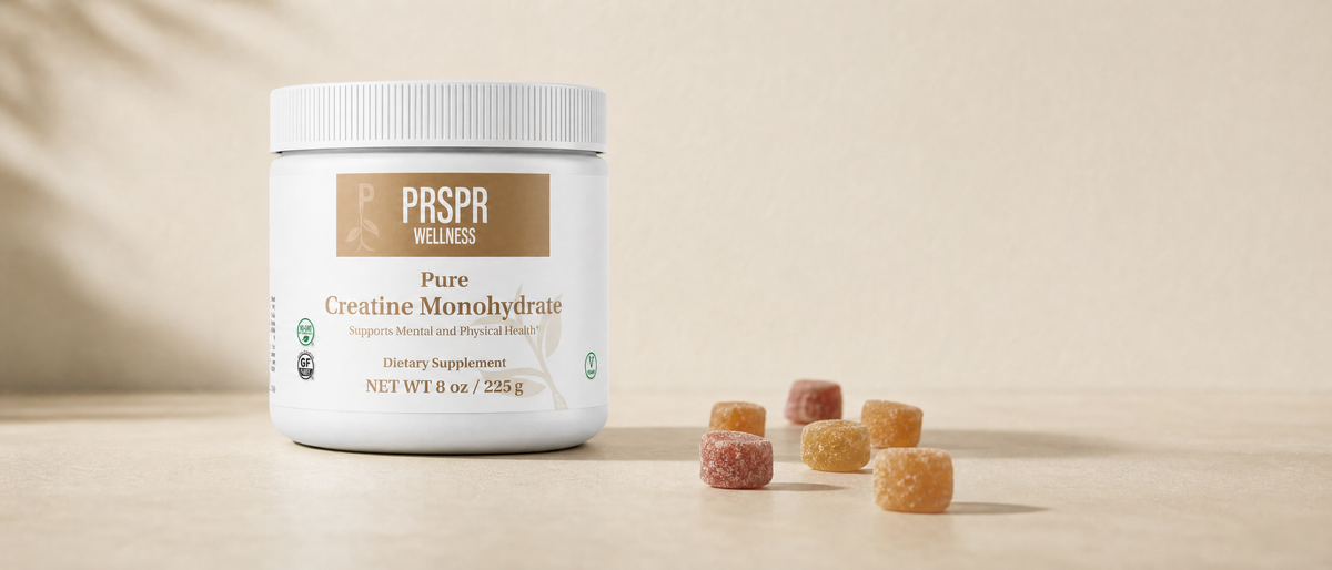 PRSPR Wellness Pure Creatine Monohydrate tub beside scattered chewy candies on a pale surface