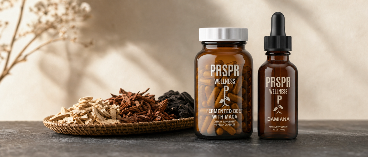 PRSPR Wellness Love Bundle bottles on a stone surface beside dried root pieces in three natural shades