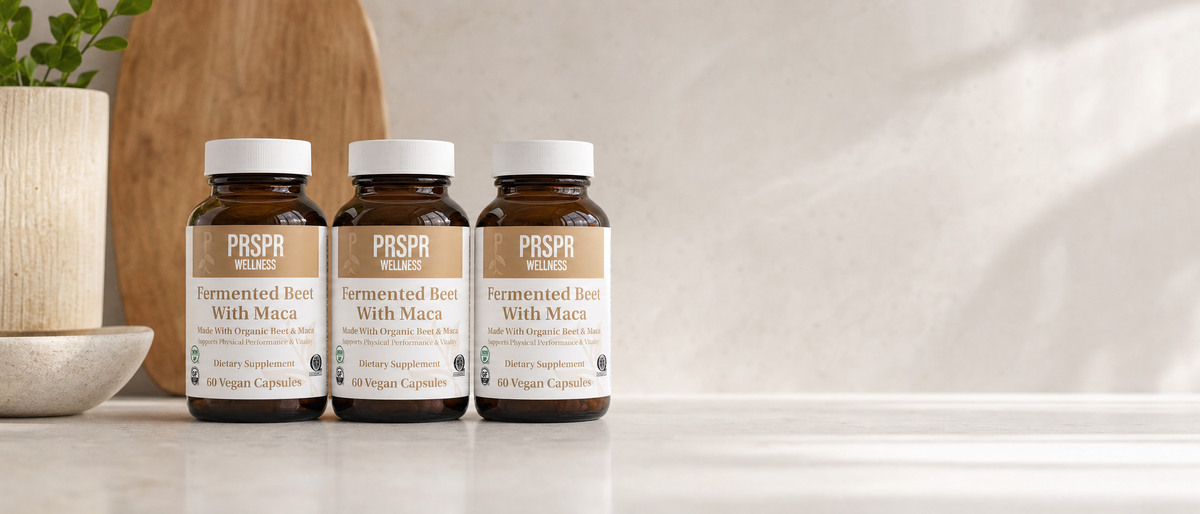 PRSPR Wellness Fermented Beet Root and Maca three bottles lined up on a kitchen counter