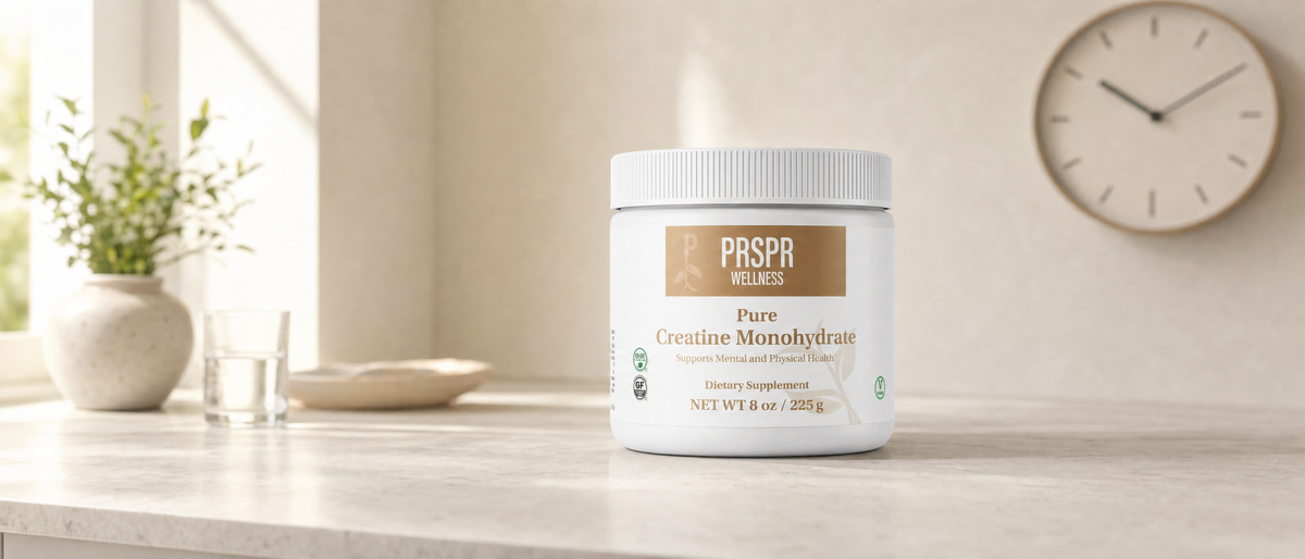 PRSPR Wellness Pure Creatine Monohydrate tub on a kitchen counter beside a wall clock