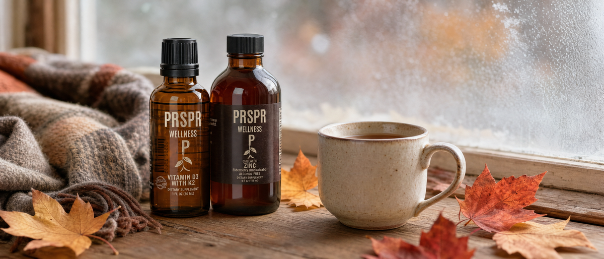 Adult Immunity Bundle bottles, Vitamin D3 with K2 and Chelated Zinc with elderberry, on an autumn windowsill with fallen leaves, a wool scarf and a mug of tea