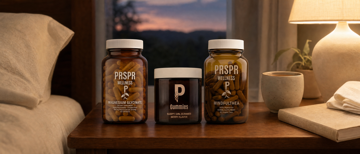 PRSPR Sleep & Recovery Stack jars (Magnesium Glycinate, Sleepy Girl Gummies, MindfulThea) on a bedside nightstand at dusk beside a cup of tea and a book