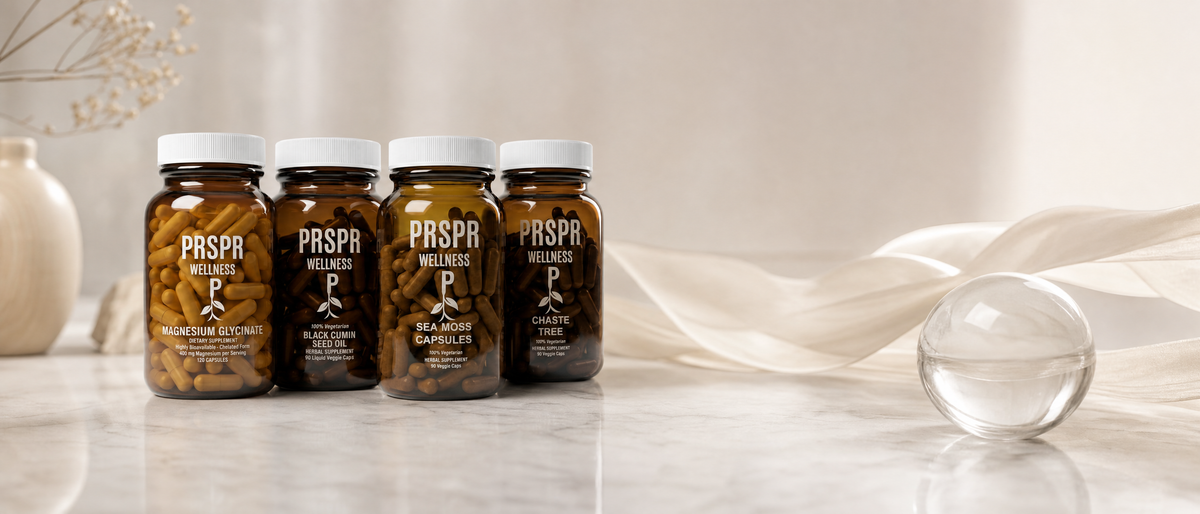 PRSPR Women's Daily Edge bundle bottles on a marble counter beside a clear glass sphere and a ribbon of pale silk, for an explainer on what hormones are
