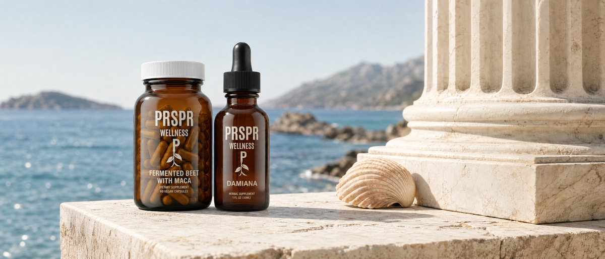 PRSPR Love Bundle bottles, Fermented Beet Root + Maca and Damiana, on a marble ledge by the sea beside a classical column and a seashell