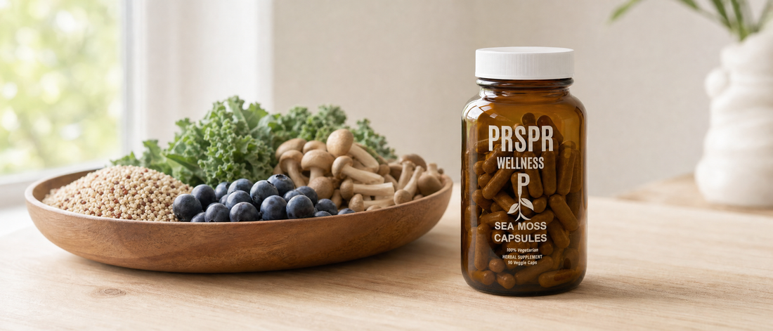 PRSPR Wellness Sea Moss Capsules jar beside a wooden bowl of quinoa, blueberries, mushrooms and kale