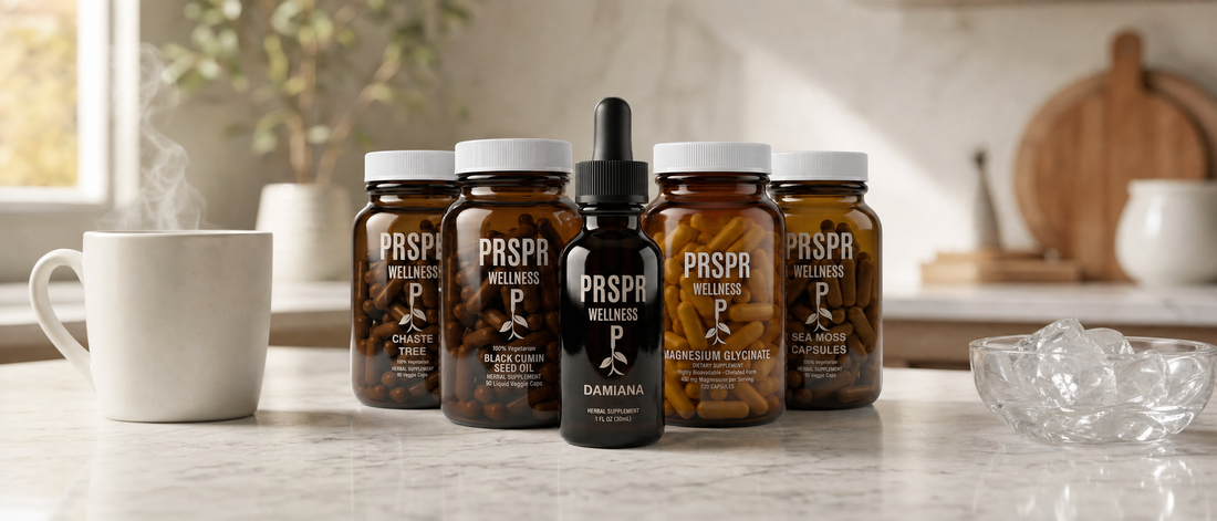 PRSPR Wellness Chaste Tree, Black Cumin Seed Oil, Damiana, Magnesium Glycinate and Sea Moss Capsules on a marble counter between a steaming mug and a bowl of ice cubes.